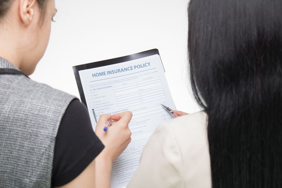 Student studying with health insurance documents